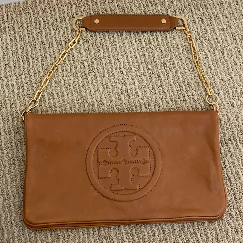 Tory Burch Reva clutch. Gently used. Some marks in leather as normal.